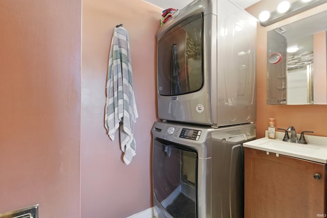 laundry room featuring stacked washer and clothes dryer