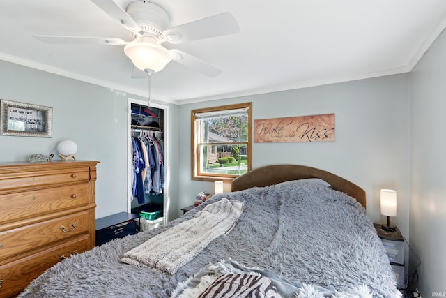 bedroom featuring a closet, ornamental molding, and ceiling fan