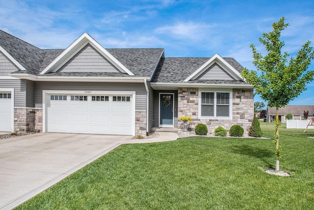 2007 Wakefield Rd, Goshen, IN 46528 - craftsman house featuring stone siding, concrete driveway, a front yard, and a garage