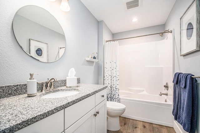 2007 Wakefield Rd, Goshen, IN 46528 - full bath featuring wood finished floors, toilet, vanity, and shower / bath combination with curtain
