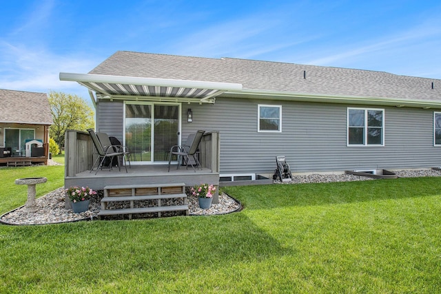 2007 Wakefield Rd, Goshen, IN 46528 - back of property with a deck, a lawn, and a shingled roof