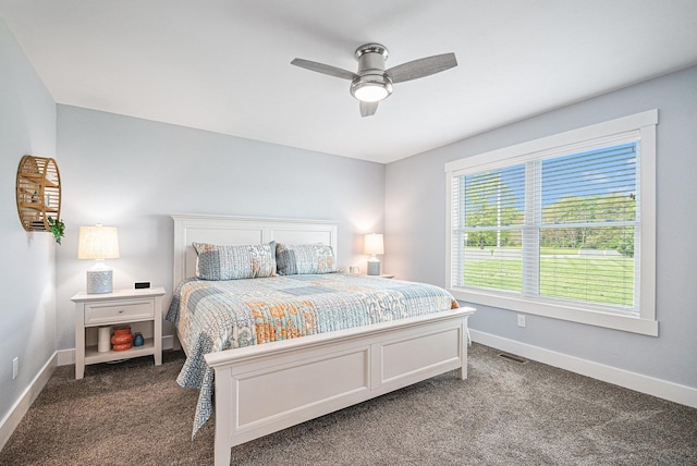 2007 Wakefield Rd, Goshen, IN 46528 - bedroom featuring baseboards, dark colored carpet, and ceiling fan