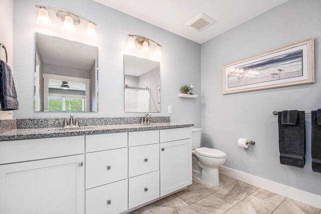 2007 Wakefield Rd, Goshen, IN 46528 - full bathroom with toilet, a shower, baseboards, double vanity, and marble finish flooring