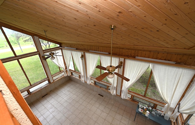 unfurnished sunroom with lofted ceiling and plenty of natural light