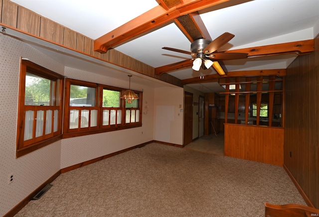 unfurnished room with light colored carpet, ceiling fan, a chandelier, and baseboards
