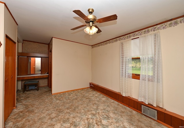 unfurnished room featuring carpet flooring and ceiling fan