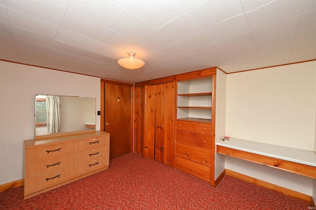 bedroom with carpet floors and baseboards