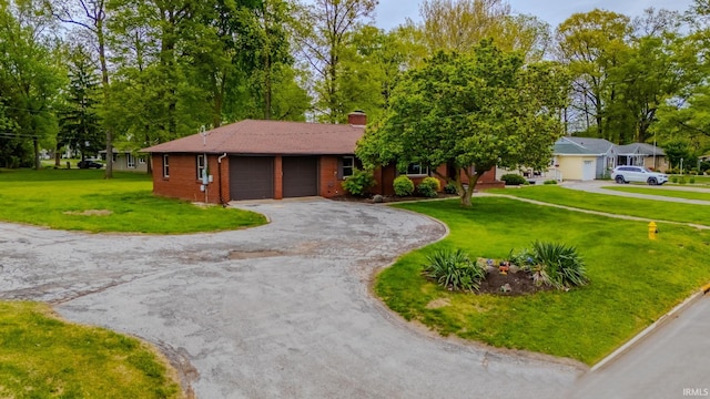 546 W Harrison, Wabash, IN 46992 - ranch-style home with an attached garage, asphalt driveway, a front yard, and a chimney
