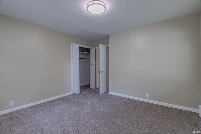 546 W Harrison, Wabash, IN 46992 - unfurnished bedroom with carpet floors, baseboards, and a closet