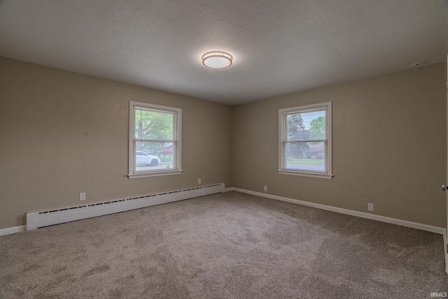 546 W Harrison, Wabash, IN 46992 - empty room with a baseboard heating unit, healthy amount of natural light, carpet, and baseboards