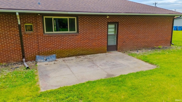 546 W Harrison, Wabash, IN 46992 - rear view of property with brick siding, roof with shingles, and a patio