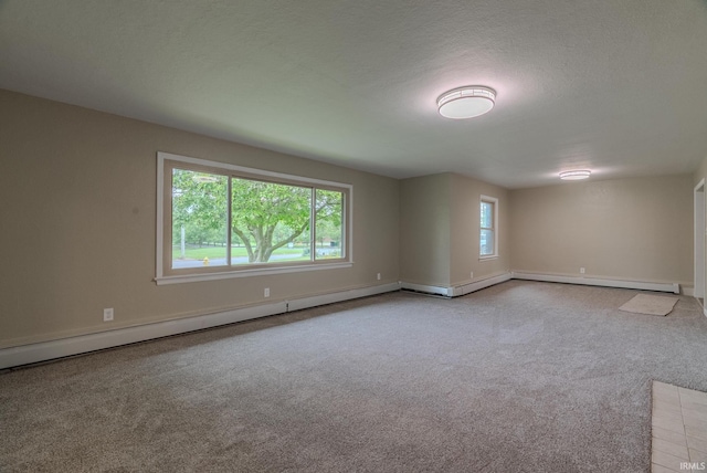 546 W Harrison, Wabash, IN 46992 - carpeted spare room with healthy amount of natural light, a baseboard radiator, and baseboards