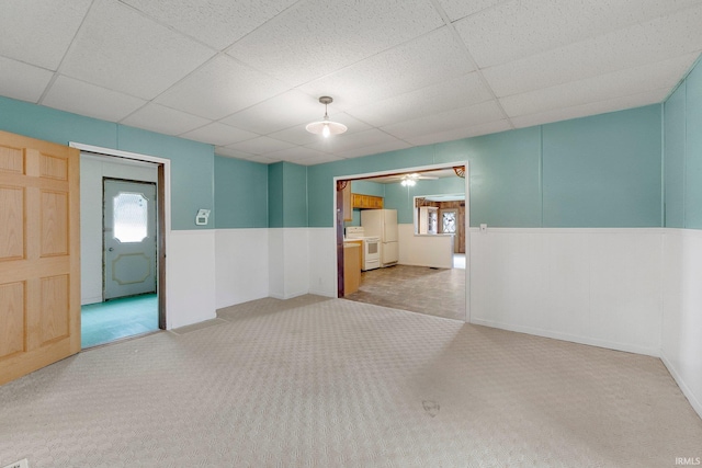 3648 E 300 S, Albion, IN 46701 - carpeted spare room featuring a drop ceiling, a wainscoted wall, and a ceiling fan