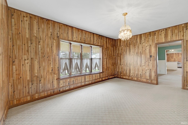 3648 E 300 S, Albion, IN 46701 - unfurnished room featuring a chandelier, carpet flooring, wooden walls, and baseboards
