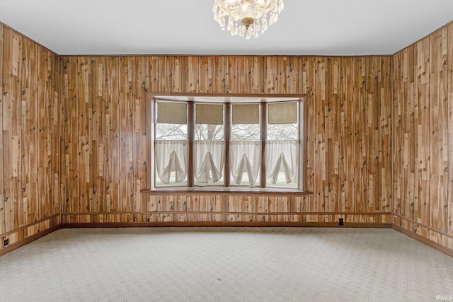 3648 E 300 S, Albion, IN 46701 - empty room with carpet floors, wood walls, a chandelier, and baseboards