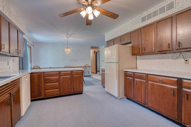 844 Old Plank Rd, Chandler, IN 47610 - kitchen featuring white appliances, wallpapered walls, brown cabinets, light carpet, and a ceiling fan