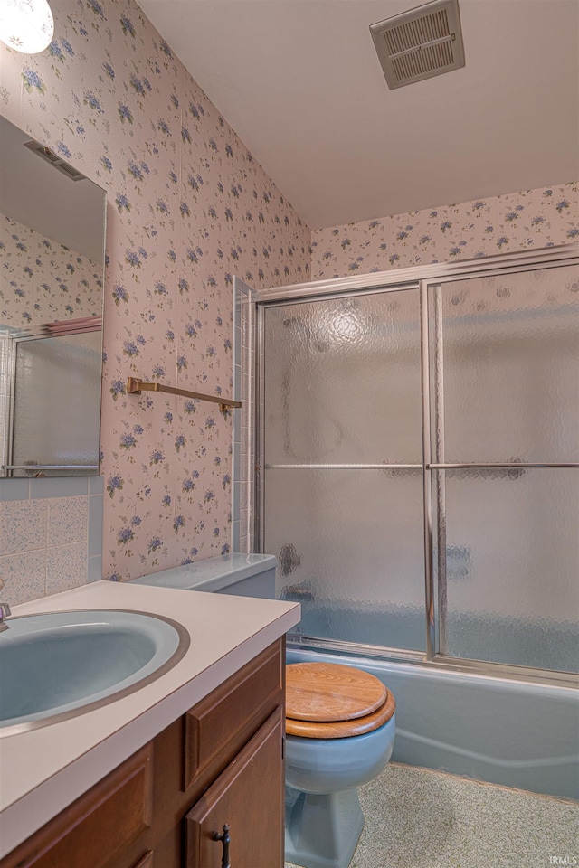 844 Old Plank Rd, Chandler, IN 47610 - bathroom featuring wallpapered walls, vanity, shower / bath combination with glass door, and toilet