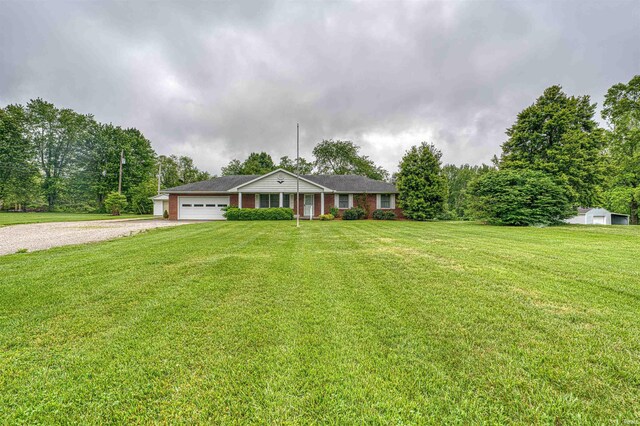844 Old Plank Rd, Chandler, IN 47610 - single story home featuring gravel driveway, a garage, and a front lawn