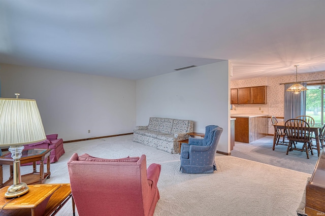 844 Old Plank Rd, Chandler, IN 47610 - living room featuring wallpapered walls, light colored carpet, and baseboards