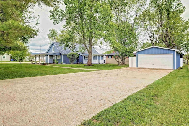 view of front of property featuring a detached garage and an outdoor structure