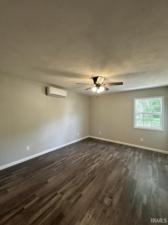 403 S Meridian St, Jasonville, IN 47438 - empty room with an AC wall unit, a textured ceiling, dark wood-style floors, a ceiling fan, and baseboards