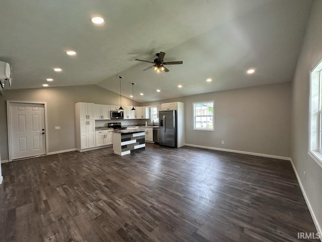 403 S Meridian St, Jasonville, IN 47438 - unfurnished living room featuring ceiling fan, vaulted ceiling, baseboards, recessed lighting, and dark wood-type flooring