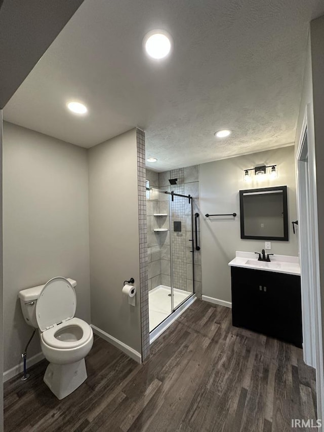 403 S Meridian St, Jasonville, IN 47438 - bathroom featuring wood finished floors, baseboards, a shower stall, and recessed lighting