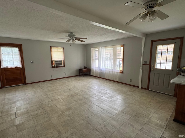 109 S 3rd St, Edwardsport, IN 47528 - entrance foyer featuring a ceiling fan, healthy amount of natural light, baseboards, and a textured ceiling