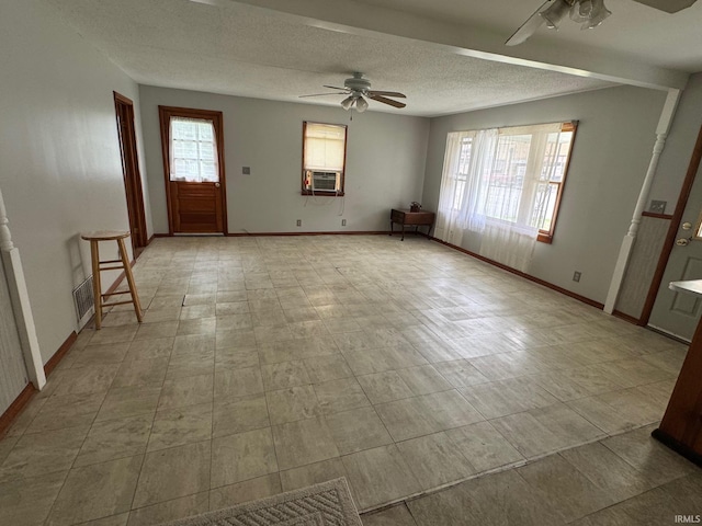 109 S 3rd St, Edwardsport, IN 47528 - foyer entrance with ceiling fan, baseboards, cooling unit, and a textured ceiling