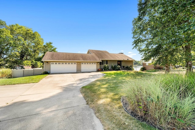10140 Jefferson Rd, Osceola, IN 46561 - ranch-style house with concrete driveway and an attached garage