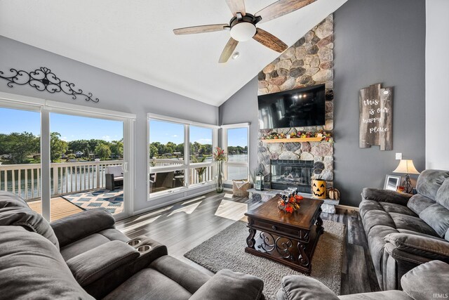 10140 Jefferson Rd, Osceola, IN 46561 - living room featuring a fireplace, high vaulted ceiling, wood finished floors, and ceiling fan