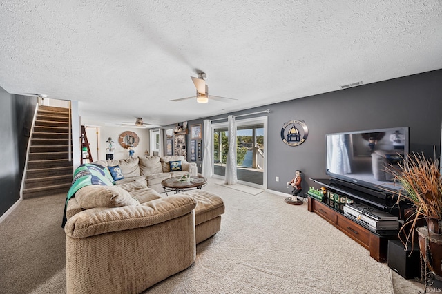 10140 Jefferson Rd, Osceola, IN 46561 - living room with stairs, carpet, ceiling fan, baseboards, and a textured ceiling