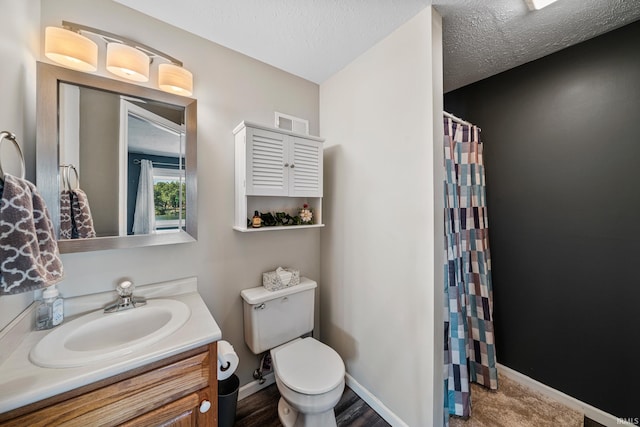 10140 Jefferson Rd, Osceola, IN 46561 - bathroom with toilet, vanity, a shower with shower curtain, baseboards, and a textured ceiling