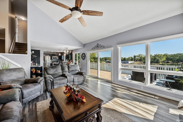 10140 Jefferson Rd, Osceola, IN 46561 - living room featuring a chandelier, wood finished floors, a ceiling fan, and high vaulted ceiling