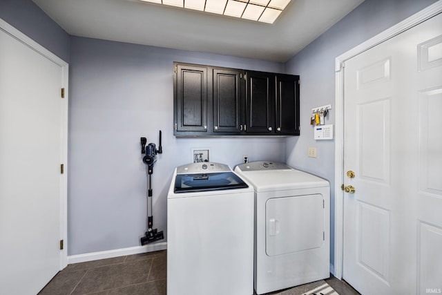 10140 Jefferson Rd, Osceola, IN 46561 - clothes washing area featuring cabinet space, separate washer and dryer, baseboards, and dark tile patterned floors