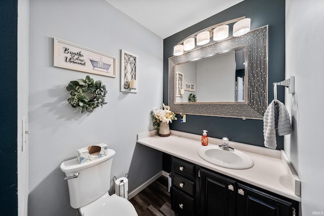 10140 Jefferson Rd, Osceola, IN 46561 - bathroom with vanity, wood finished floors, toilet, and baseboards