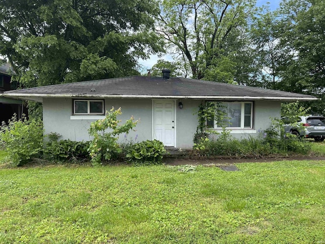 8965 W County Road 100 N, Richland, IN 47634 - view of side of home featuring stucco siding and a lawn
