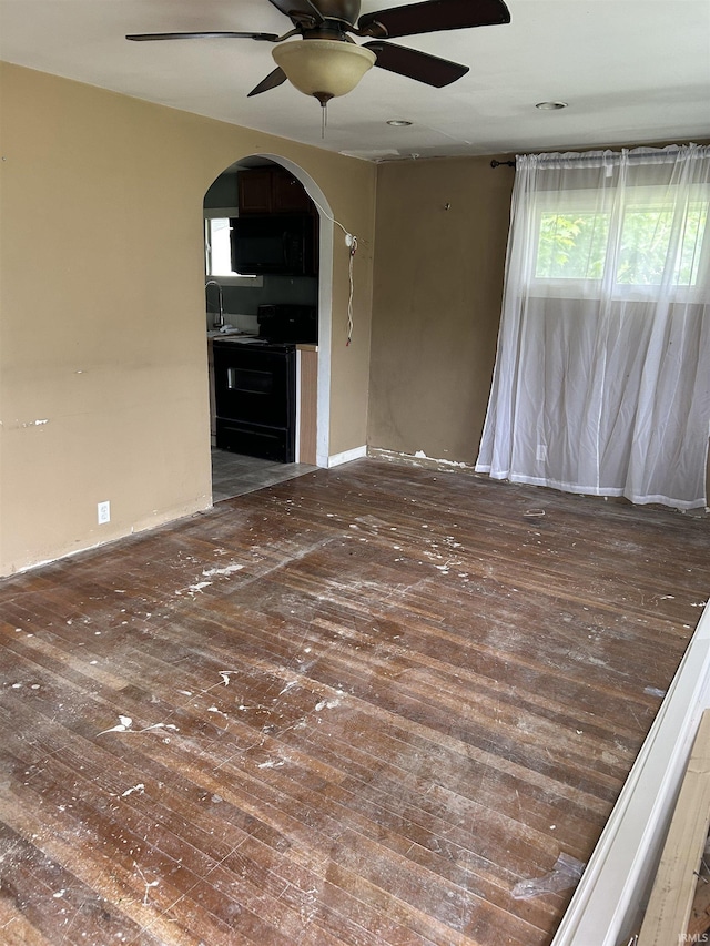 8965 W County Road 100 N, Richland, IN 47634 - spare room with ceiling fan, wood-type flooring, arched walkways, and a sink