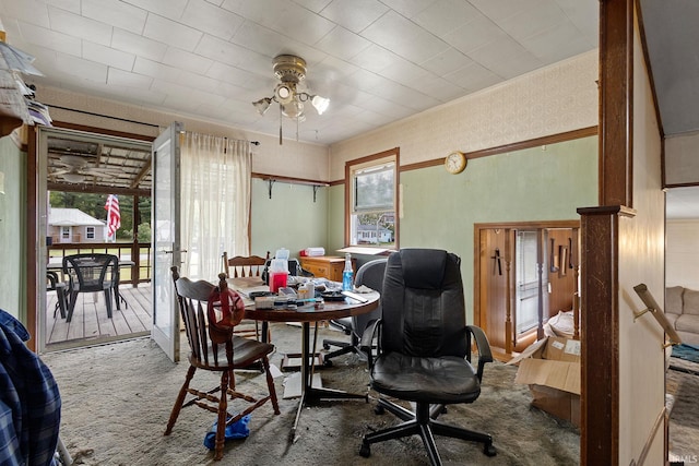 dining space featuring carpet flooring and a ceiling fan