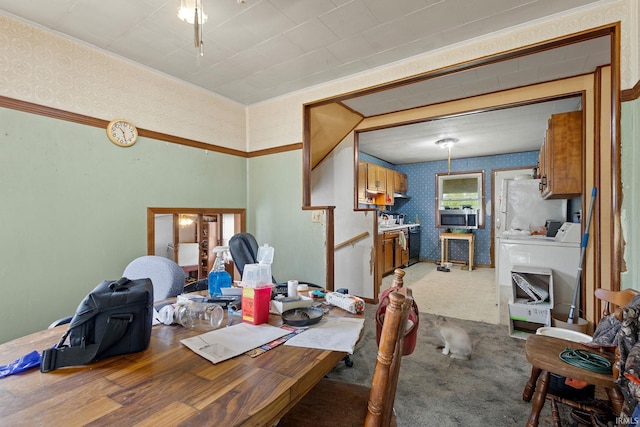 dining room featuring wallpapered walls and carpet
