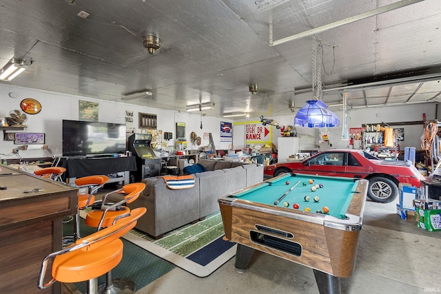 game room with concrete floors and billiards
