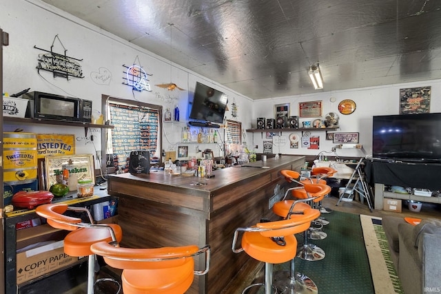 bar area with black microwave