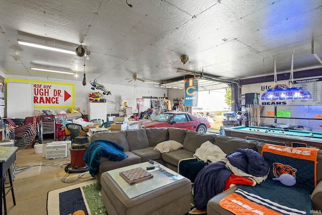 playroom featuring concrete flooring, a garage, and billiards table