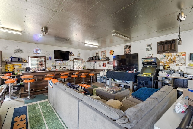 living room featuring a bar and a wall unit AC