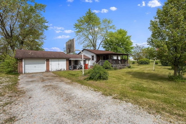 view of front facade featuring a porch, dirt driveway, an attached garage, a front yard, and a chimney