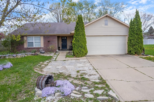 1308 Tedlee Dr, Kokomo, IN 46901 - ranch-style home with brick siding, a garage, driveway, and a front yard