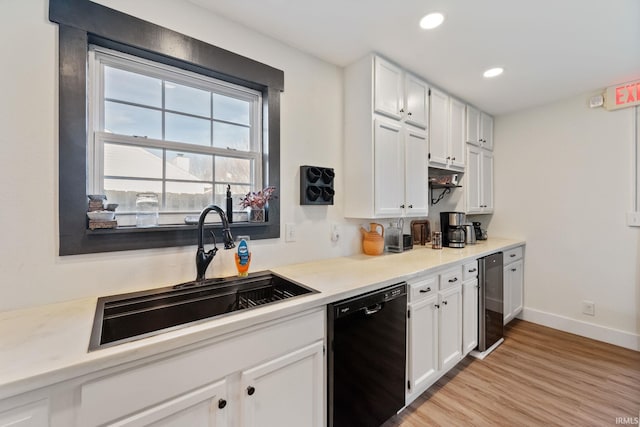 1308 Tedlee Dr, Kokomo, IN 46901 - kitchen featuring black dishwasher, a sink, wine cooler, white cabinets, and light wood finished floors