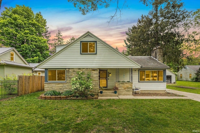 3430 Woodrow Ave, Fort Wayne, IN 46805 - bungalow-style house featuring covered porch, a chimney, and stone siding