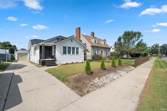 bungalow-style house featuring concrete driveway, an outdoor structure, and a garage