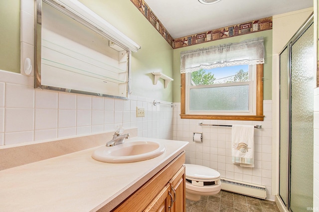 56226 Tanglewood Ln, Osceola, IN 46561 - full bathroom featuring a baseboard radiator, tile walls, a stall shower, toilet, and vanity